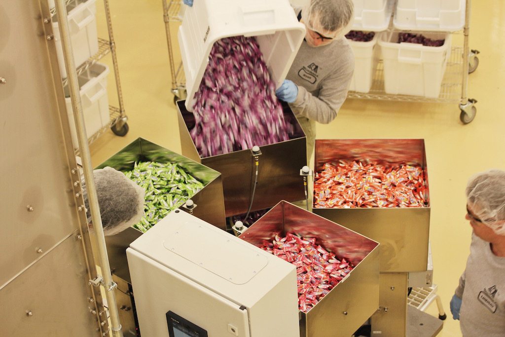 Workers weigh and sort HI-CHEWS