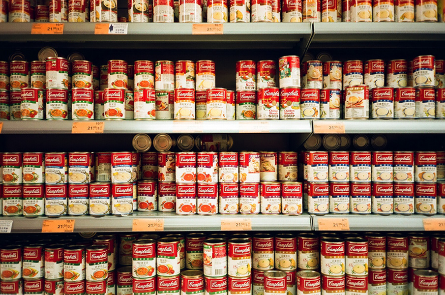 cans of campbell soup on a shelf