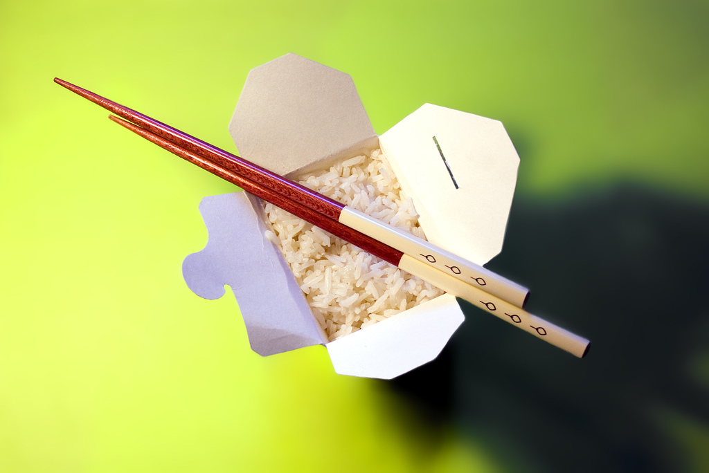 takeout container of rice and chopsticks