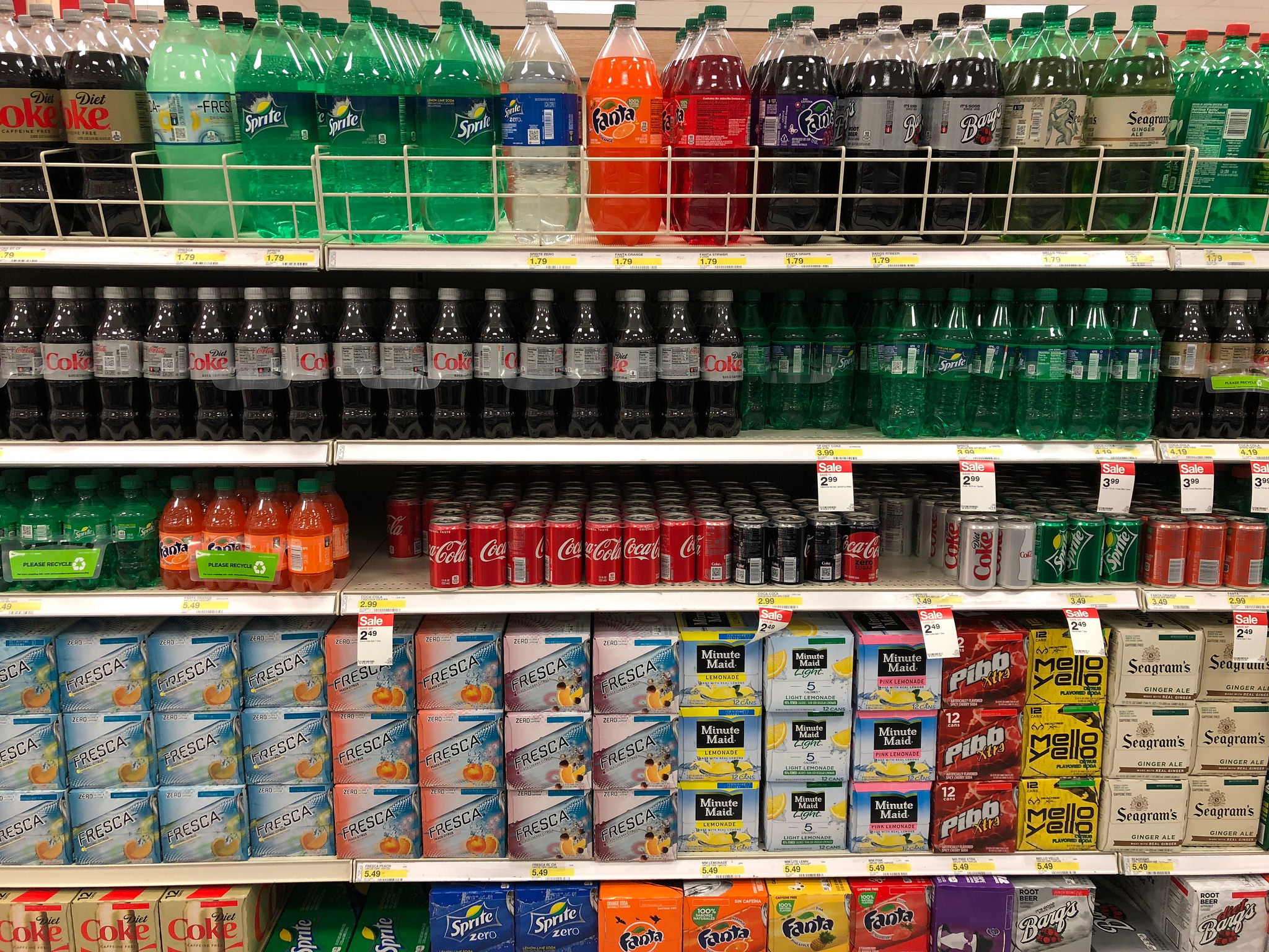 rows of soda at a grocery store