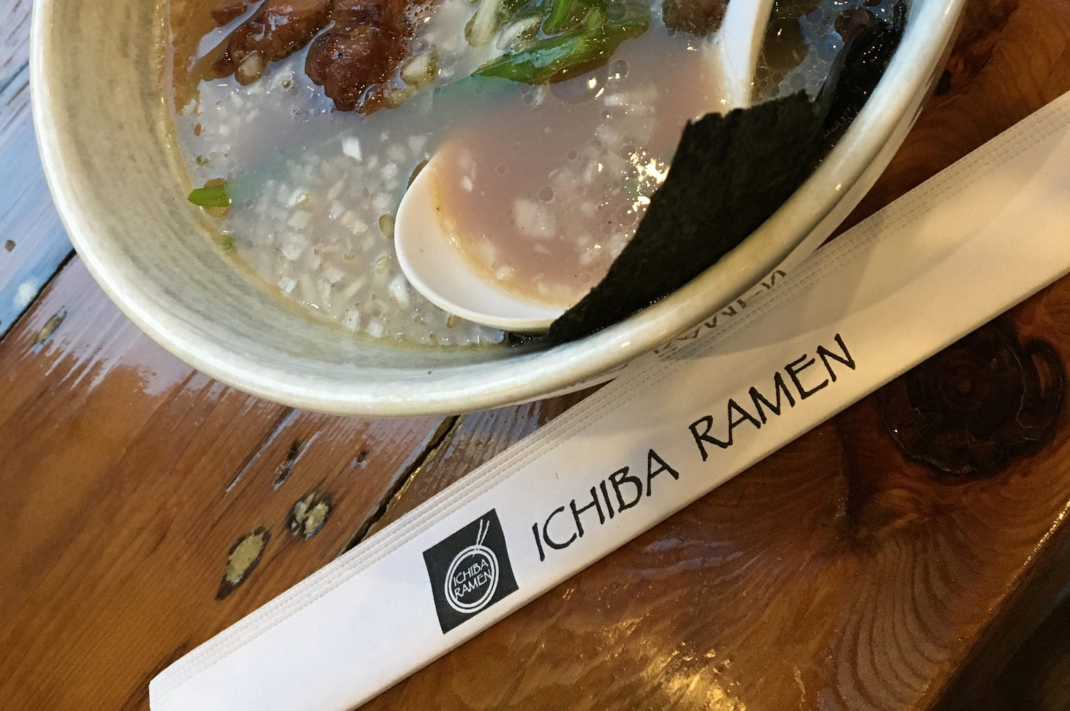 A bowl of ramen and a pair of chopsticks from Ichiba Ramen