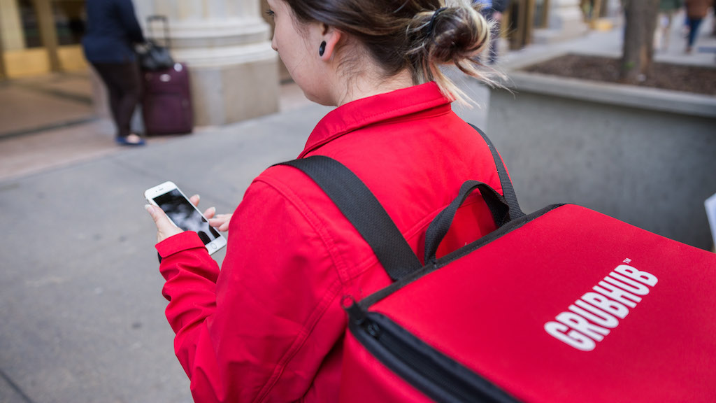 A Grubhub driver uses the GrubHub delivery app