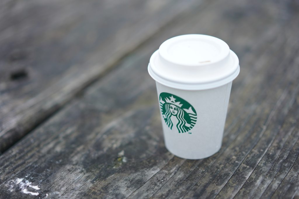 Starbucks cup on bench