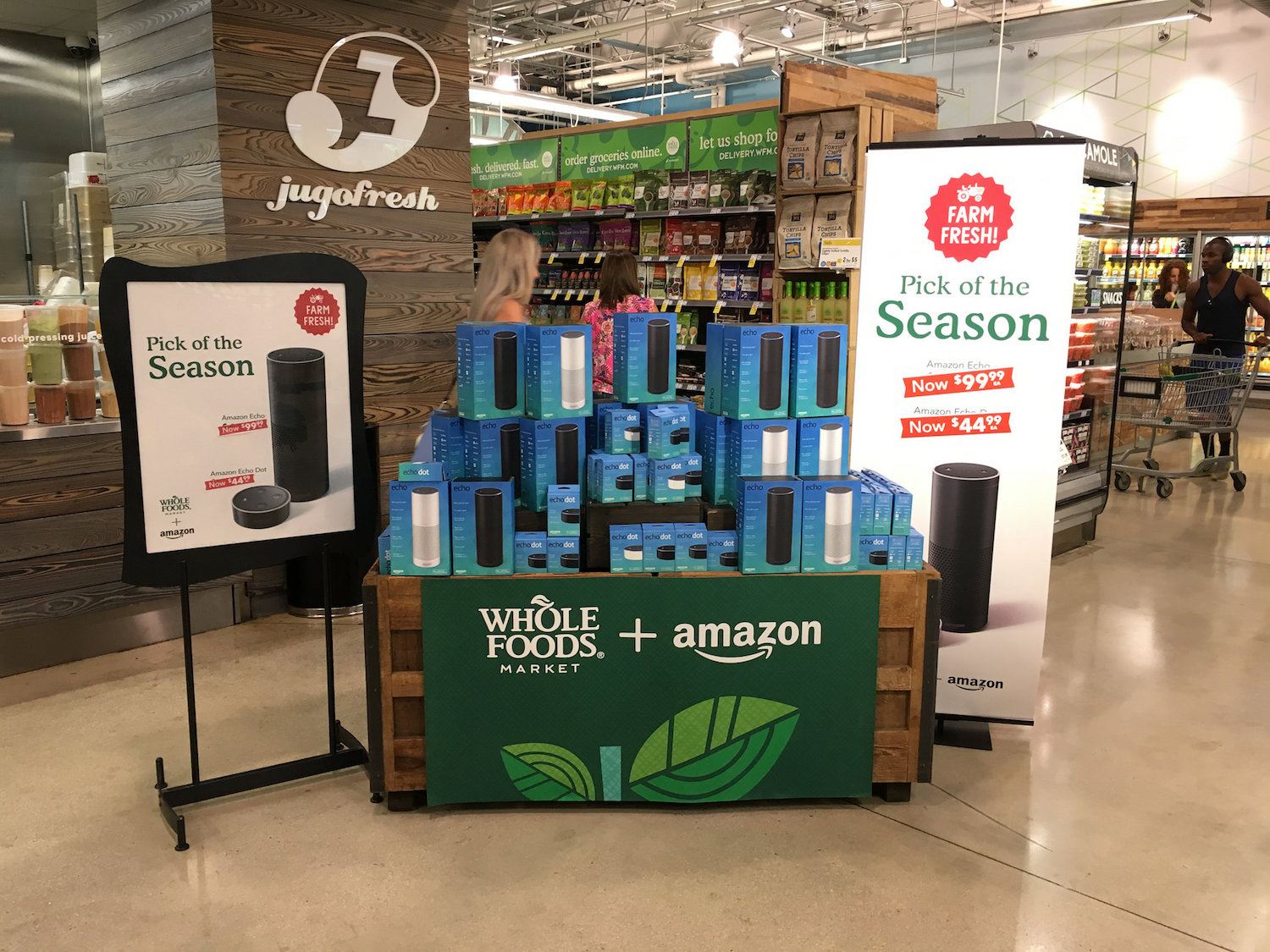 Amazon's effect on pricing at Whole Foods / a stack of Amazon Echoes