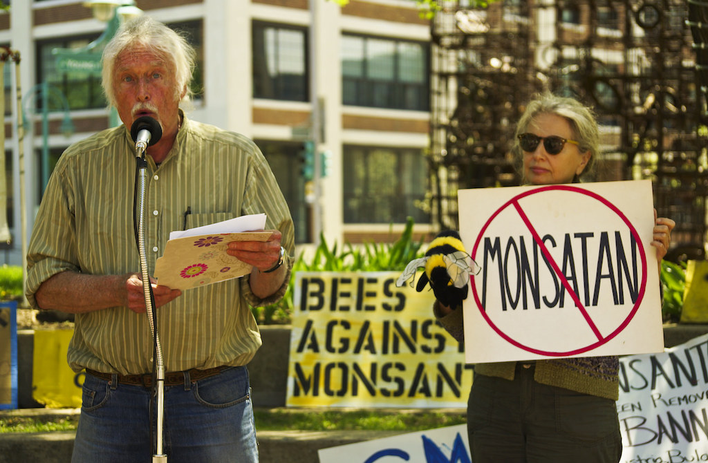 two people rallying against monsanto