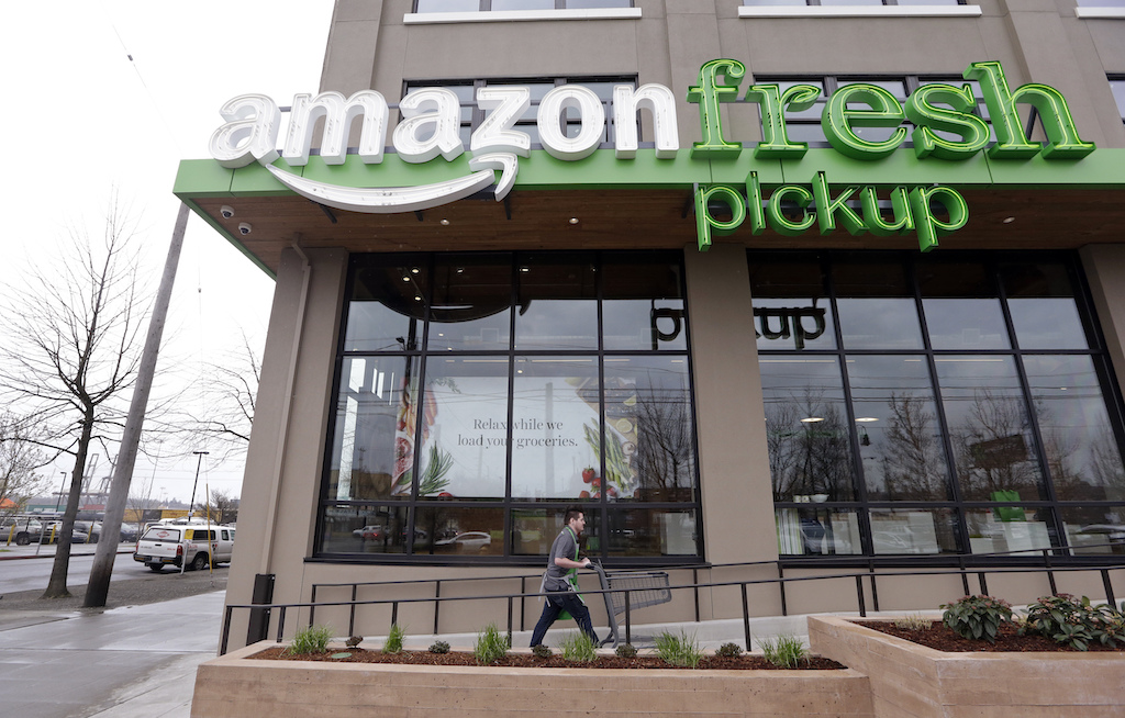 Storefront of AmazonFresh Pickup location in Seattle. Amazon.com Inc. reports financial earnings Thursday, April 27, 2017. (AP Photo/Elaine Thompson, File)