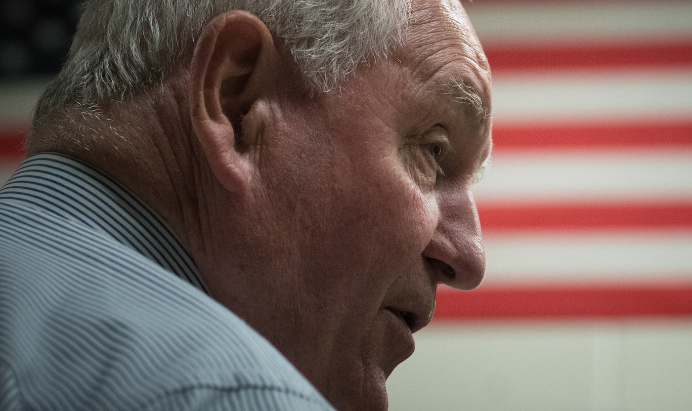 Sonny Perdue in front of an American flag