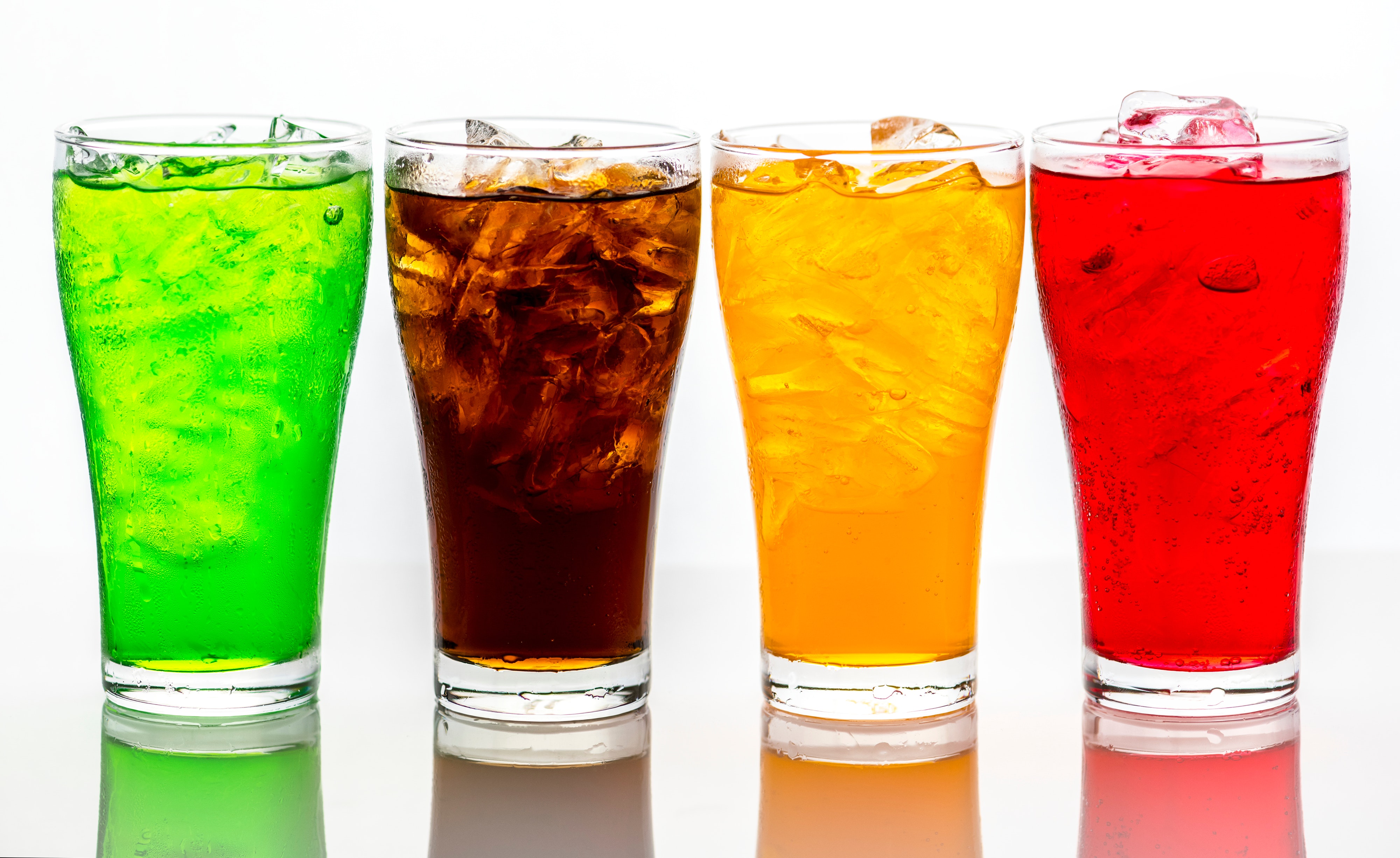 Four colored beverages in a line.