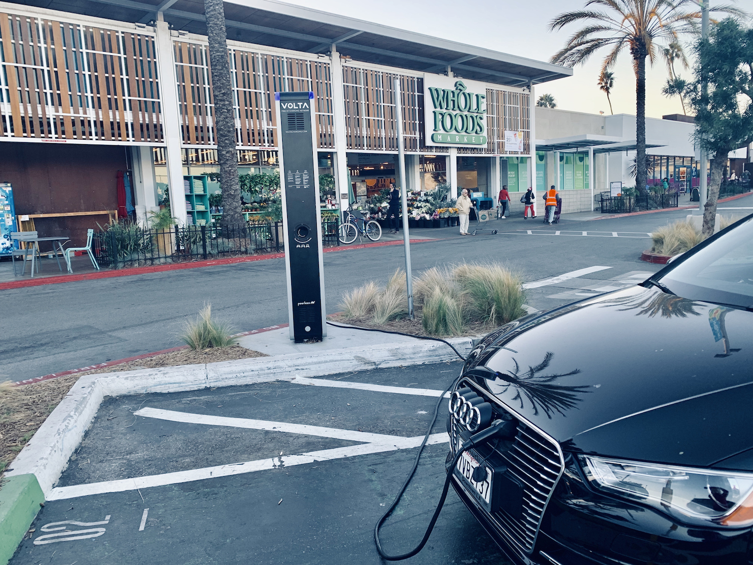 Car charges outside Whole Foods