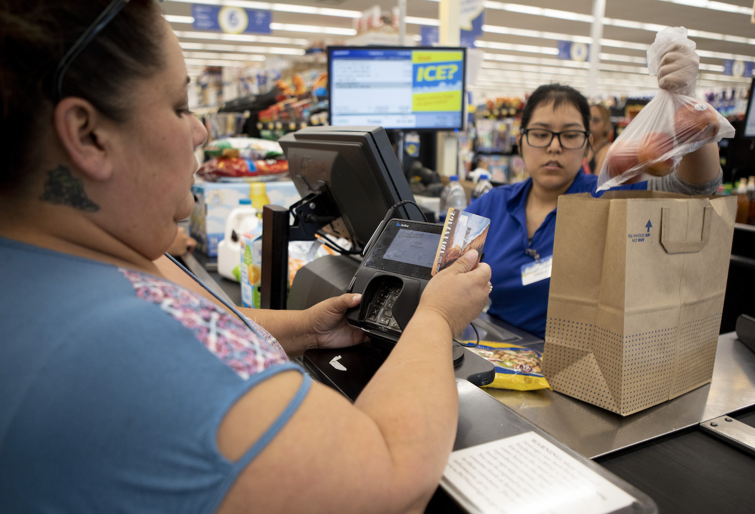 Antoinette Martinez uses CalFresh to pay for her groceries at FoodMaxx on July 26, 2019
