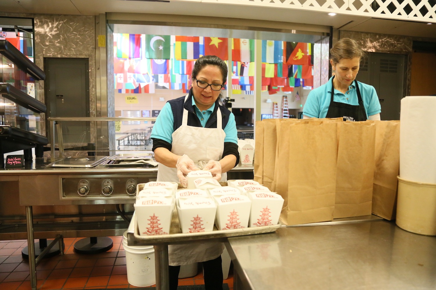 School nutritional officials prepare grab and go meals for Northshore students, who are learning remotely as in-person instruction is on hold due to coronavirus concerns.
