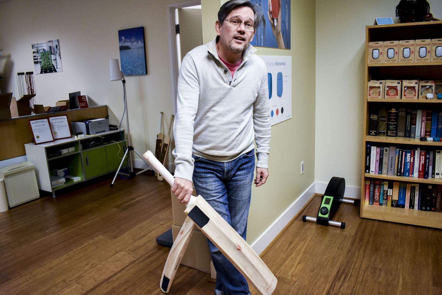 Velvetwire's Eric Bodnar poses with a sensor-clad cricket bat. The technology that measures the velocity of a swing may also be able to track the flow of bulk goods from a dispenser. (April 2020)