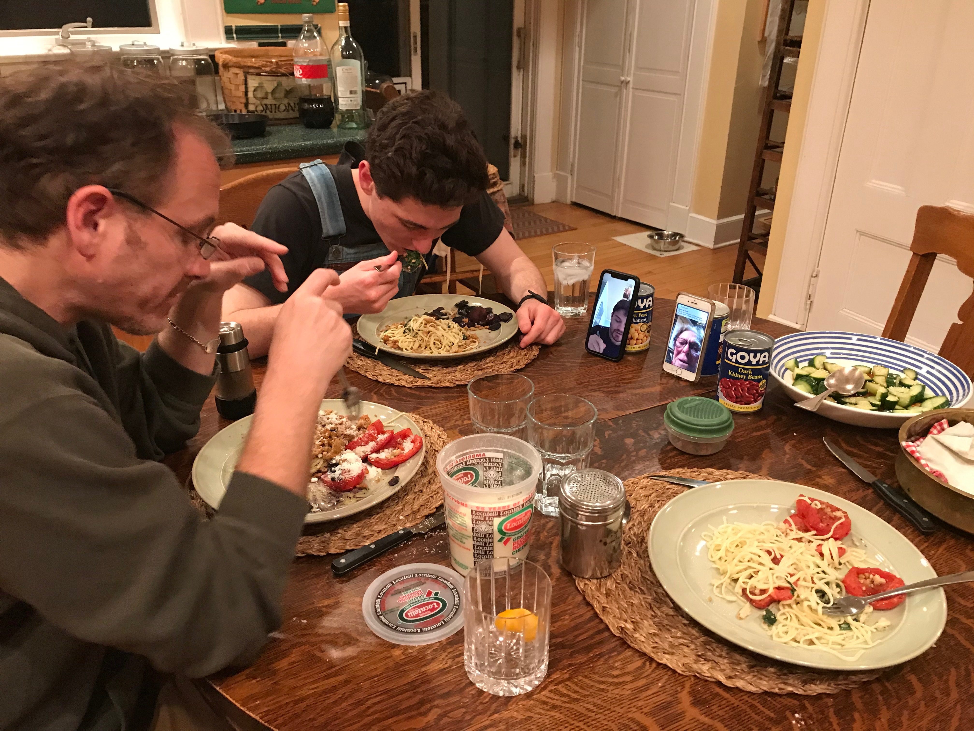 Family eating with Facetime at dinner table