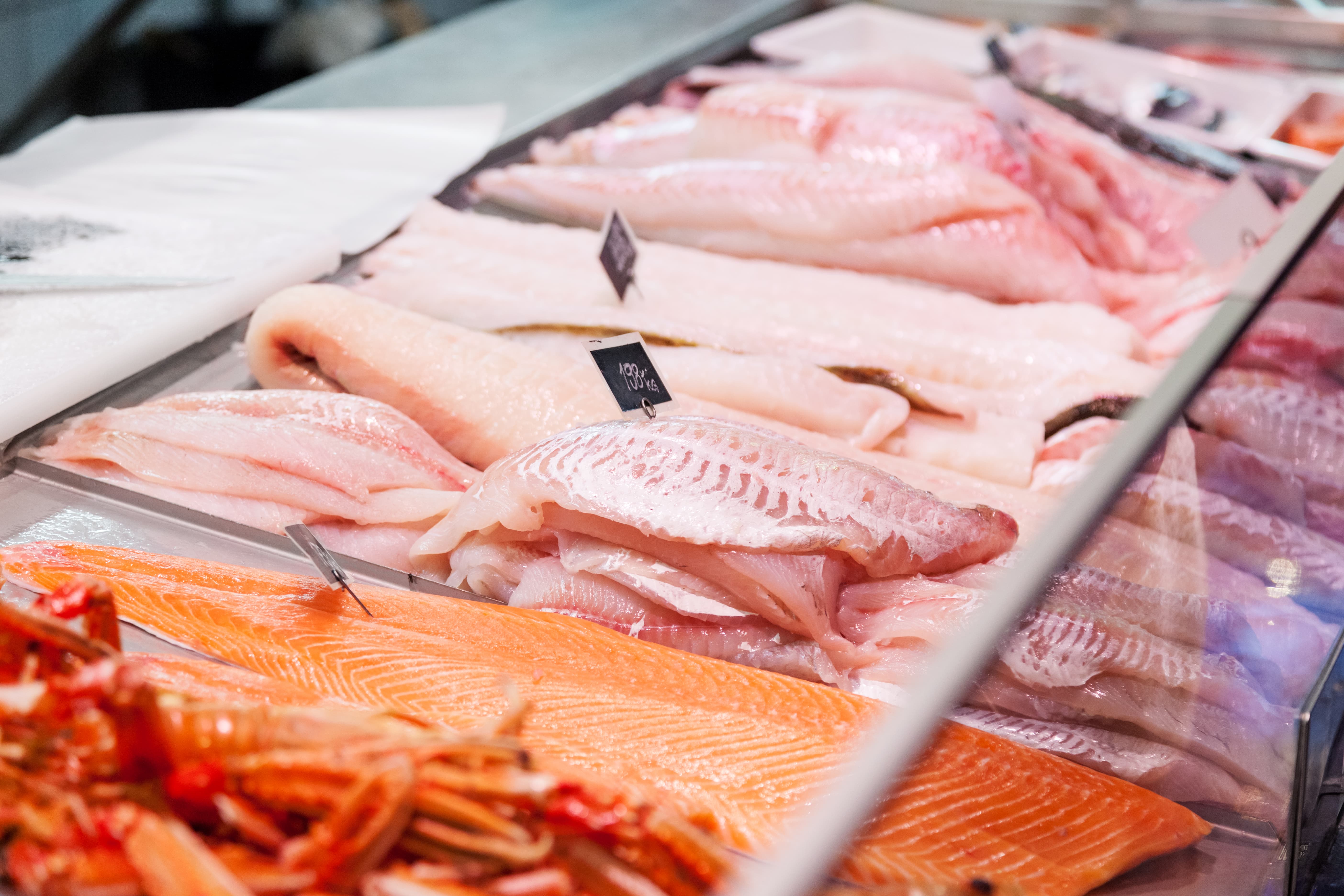 Fresh seafood displayed on ice in fish market (April 2020)