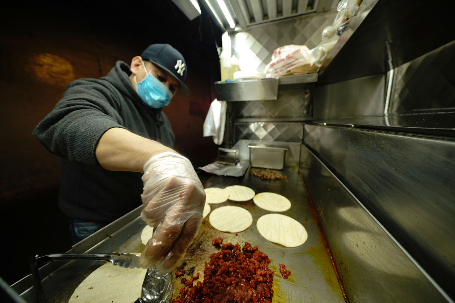 A taco vendor during the coronavirus pandemic on May 18, 2020 in the borough of Queens in New York City. (June 2020)