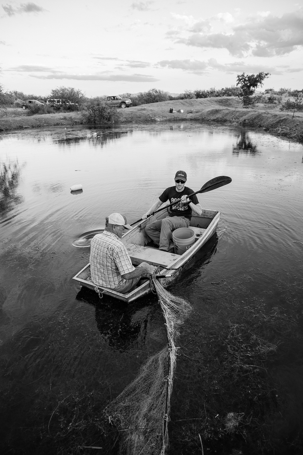 Chuck Minckley and Thomas Hafen check netting for Yaqui catfish in Sonora, Mexico July 2020