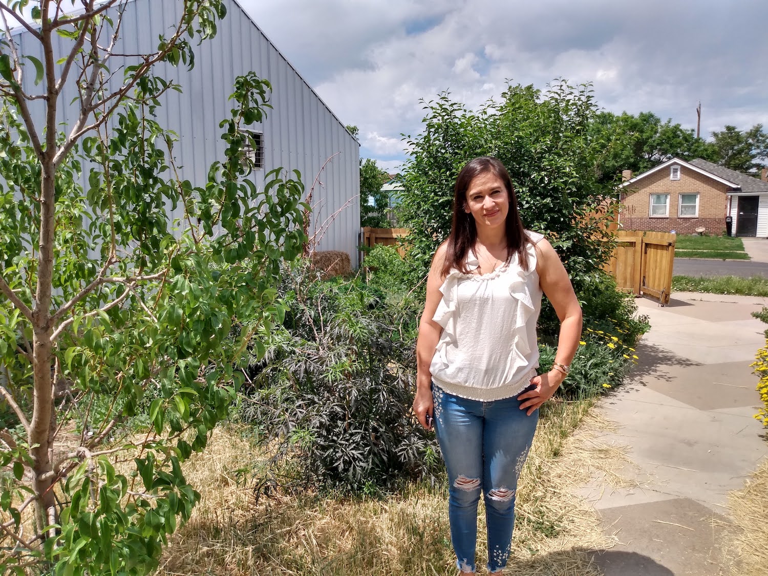 Elida Hermosillo, a north Denver resident of Elyria Swansea in GrowHaus yard July 2020