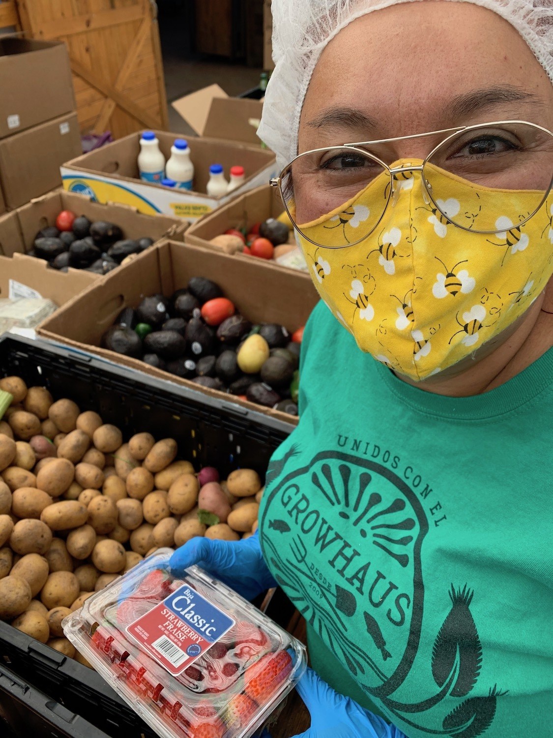 Karla Olivas, one of GrowHaus's promotoras packs rescued produce as part of the organization's 