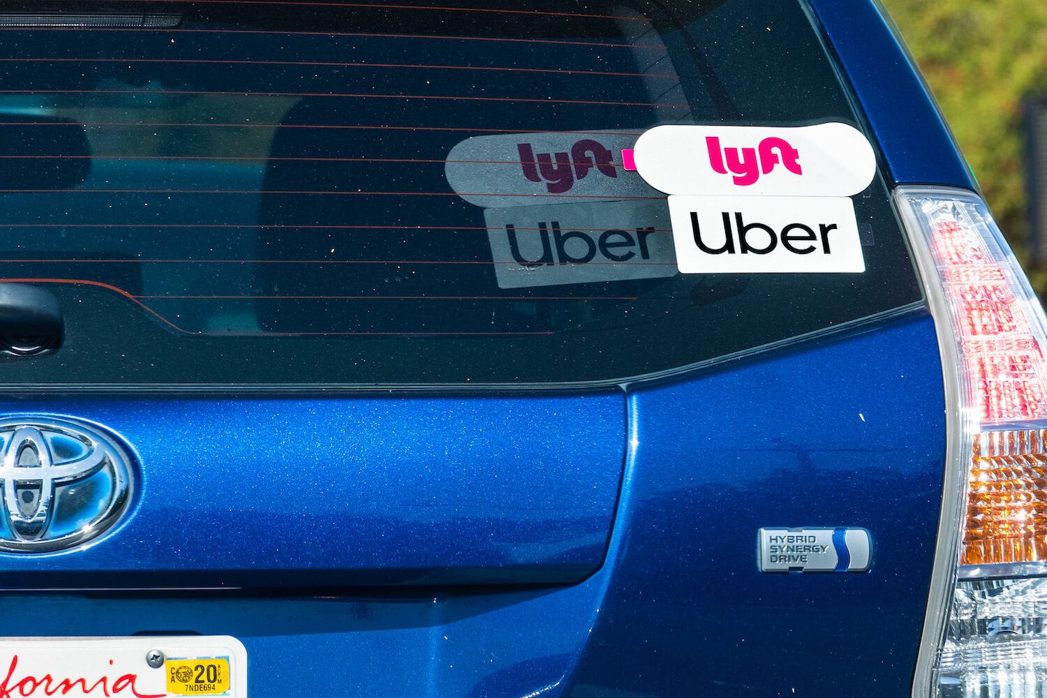 blue Prius with Uber and Lyft sticker in California August 2020