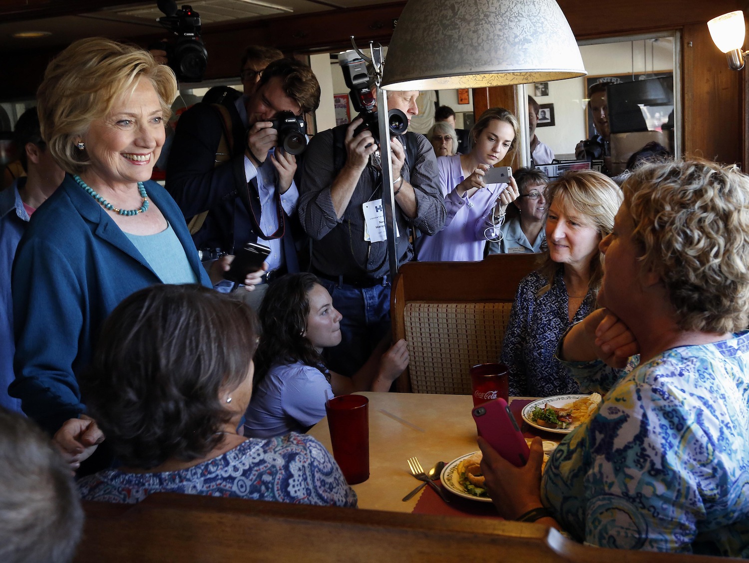 Democratic presidential candidate Hillary Rodham Clinton greets customers during a campaign stop at the Union Diner, Thursday, Sept. 17, 2015, in Laconia, N.H.