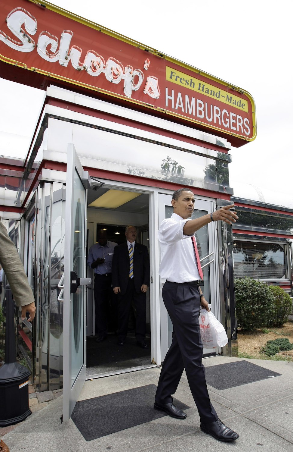 Democratic presidential candidate Sen. Barack Obama, D-Ill., leaves after a campaign stop at Schoop's diner in Portage, Ind., Wednesday, Aug. 6, 2008.