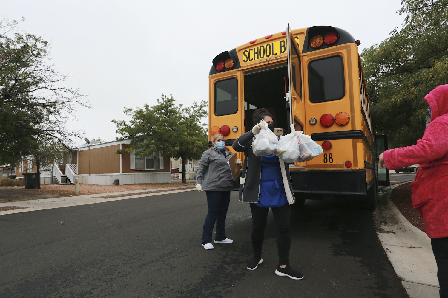 School lunch is unloaded from a school bus during Covid-19. October 2020