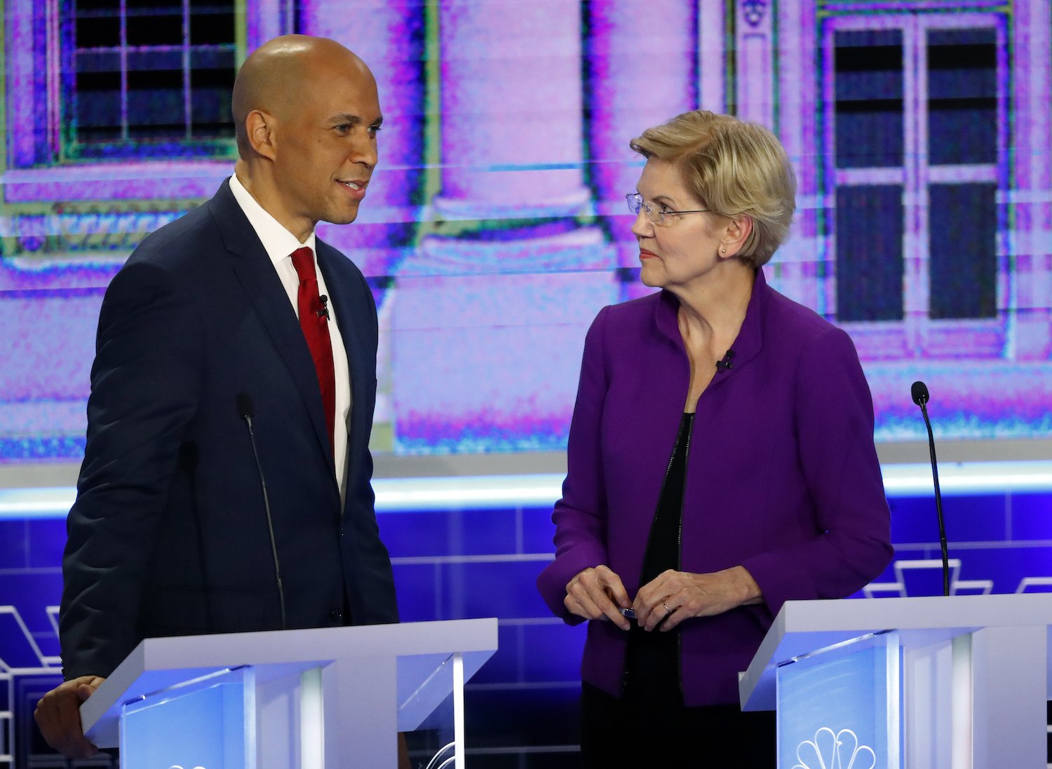 Democratic presidential candidates Sen. Cory Booker, D-N.J., talks with Sen. Elizabeth Warren, D-Mass., right, before the start of a Democratic primary debate hosted by NBC News at the Adrienne Arsht Center for the Performing Art, Wednesday, June 26, 2019, in Miami.