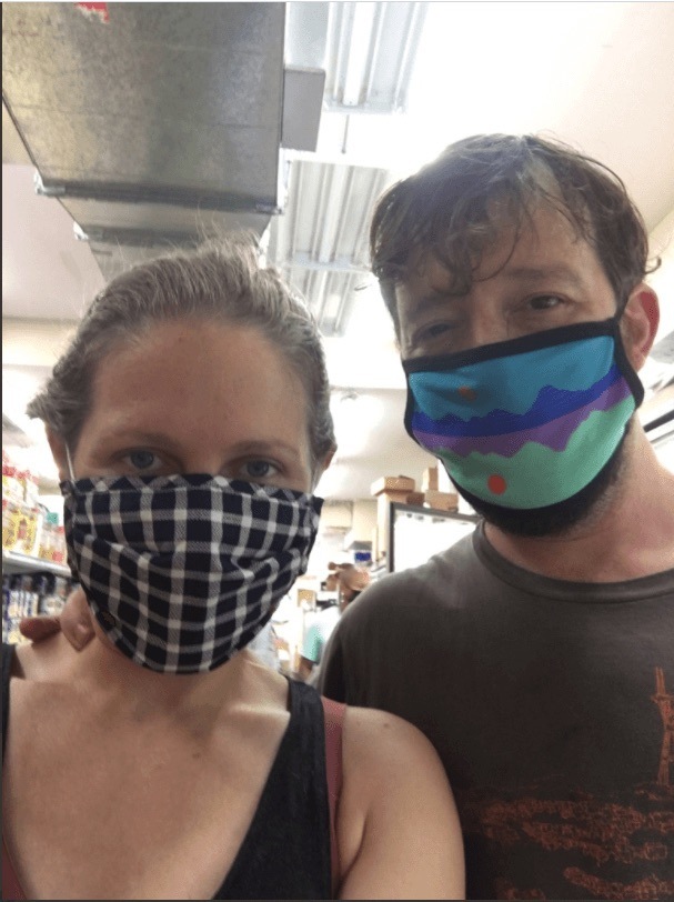 Jesse Hirsch and Abby stand inside the surplus grocer during the pandemic. November 2020