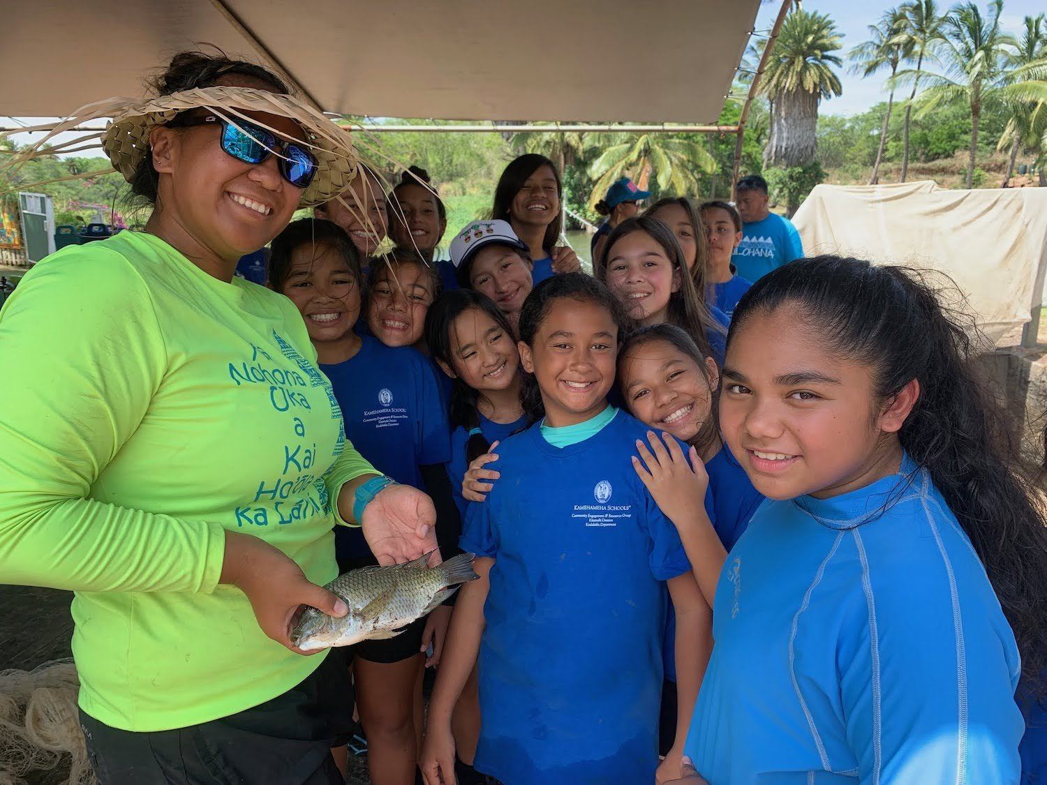 MLEF Staff showing students an example of iʻa—fish, found in Loko ea. December 2020
