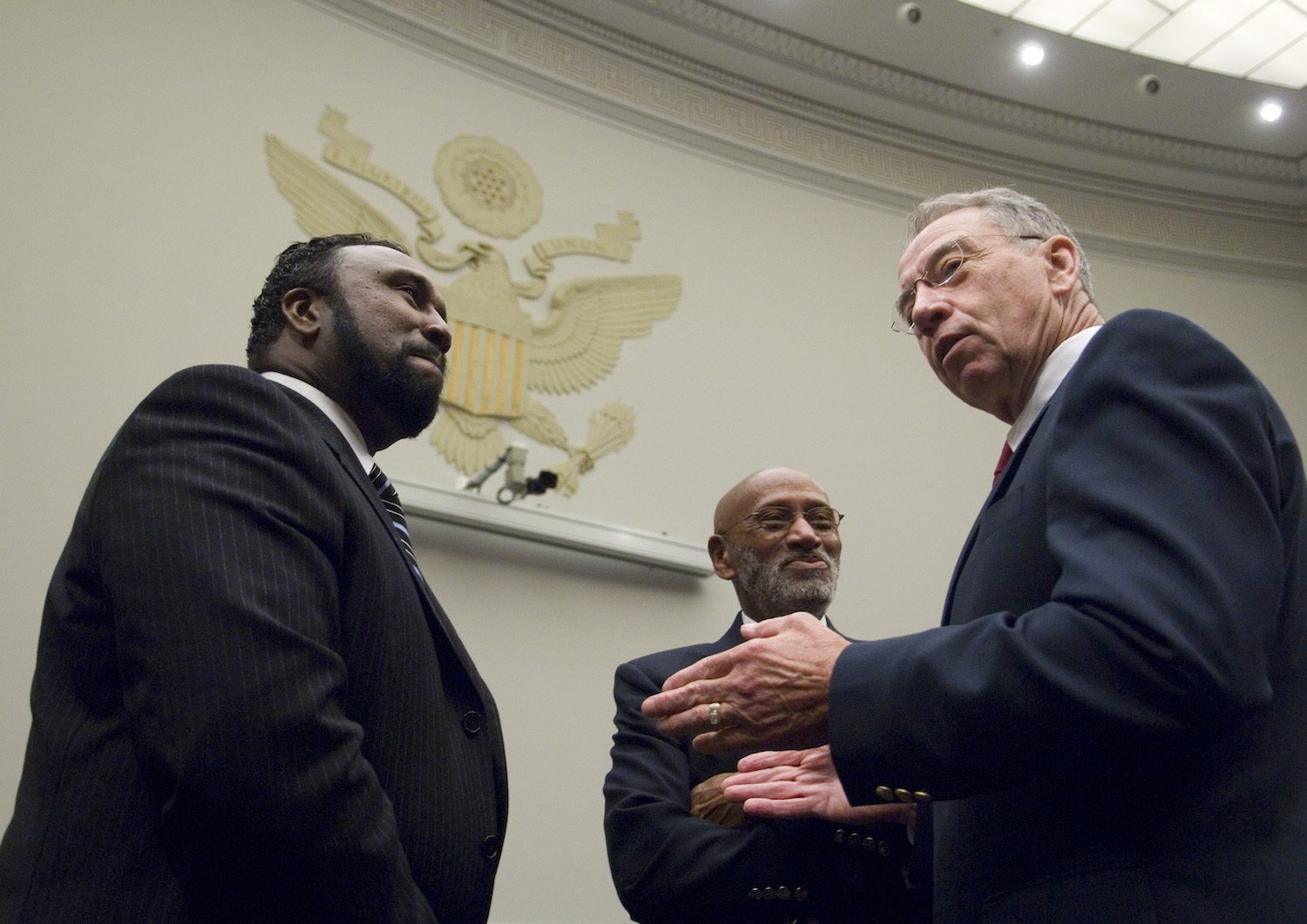 From left, John Boyd Jr., president of the National Black Farmers Association, Lawrence Lucas, president USDA Coalition of Minority Employees, and Sen. Charles Grassley, R-Iowa, talk before the start of the House Judiciary Committee Constitution, Civil Rights, and Civil Liberties Subcommittee hearing on H.R.558, the 