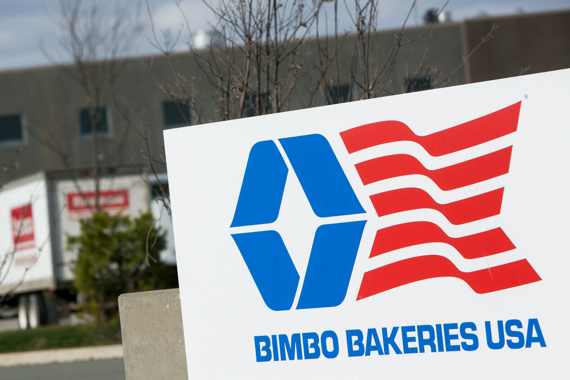 A logo sign outside of a facility occupied by Bimbo Bakeries USA in Breinigsville, Pennsylvania. December 2020