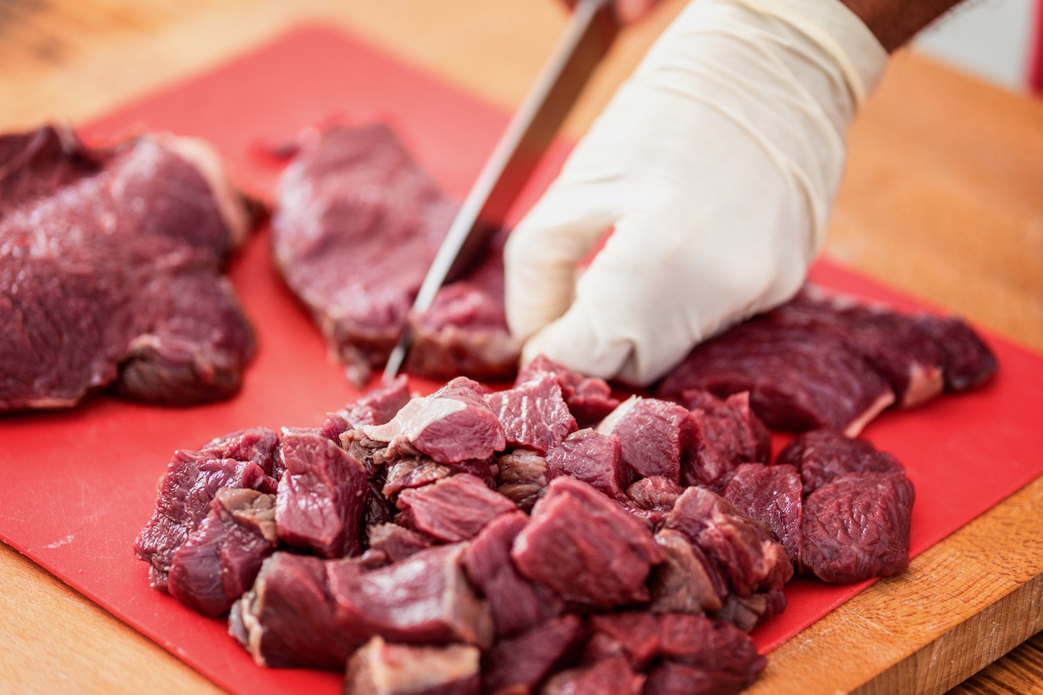 Game meat cut into cube shaped chunks, close up, selective focus. December 202