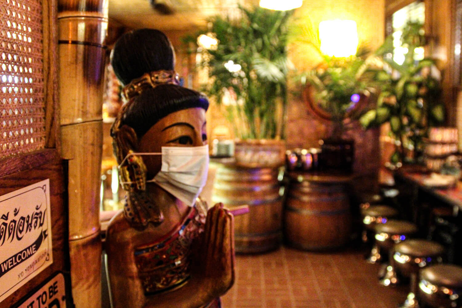 A statue wearing a mask at Thai Diner. December 2020