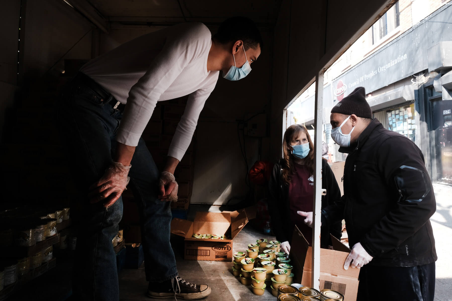 Food is distributed to hundreds outside of a Brooklyn mosque and cultural center on December 11, 2020 in New York City.