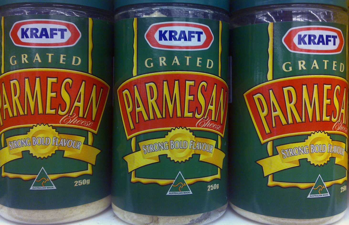 Kraft grated parmesan with strong bold flavor on a shelf. Jan. 2021