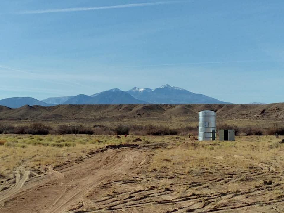 Thompson is working to restore abandoned farm land in the Little Colorado Valley on the Navajo Nation. The San Francisco Peaks are in the background. February 2021