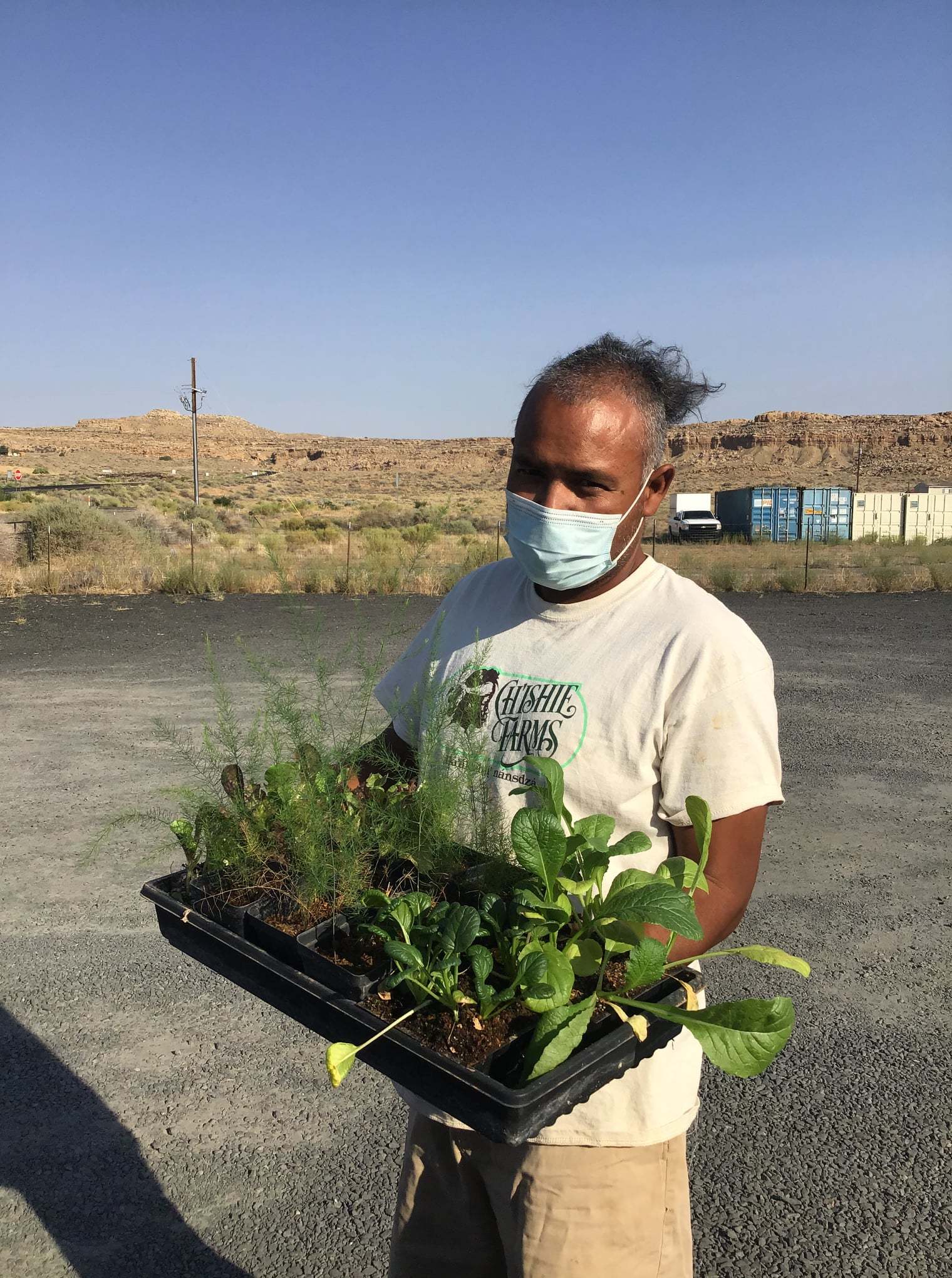 Tyrone Thompson of Ch'ishie Farms displays his bedding plants. February 2021