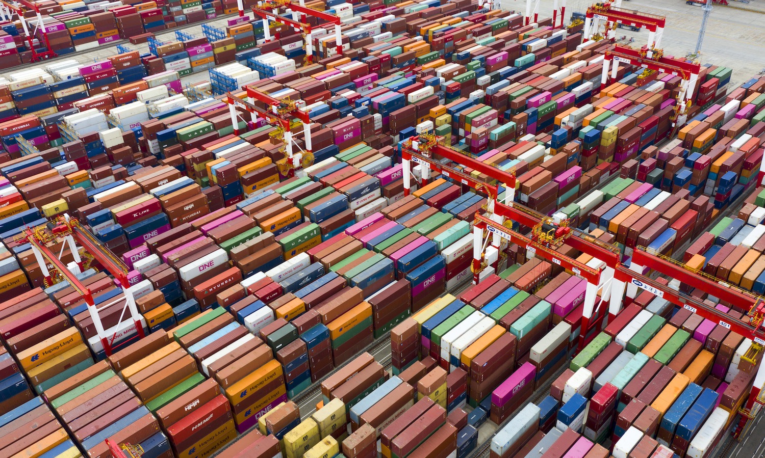 Aerial photography of Yangshan deep water port terminal ships for lifting operations, including many of the world's container ships carrying the exhibits for the third China International Fair. Shanghai, China, October 25, 2020
