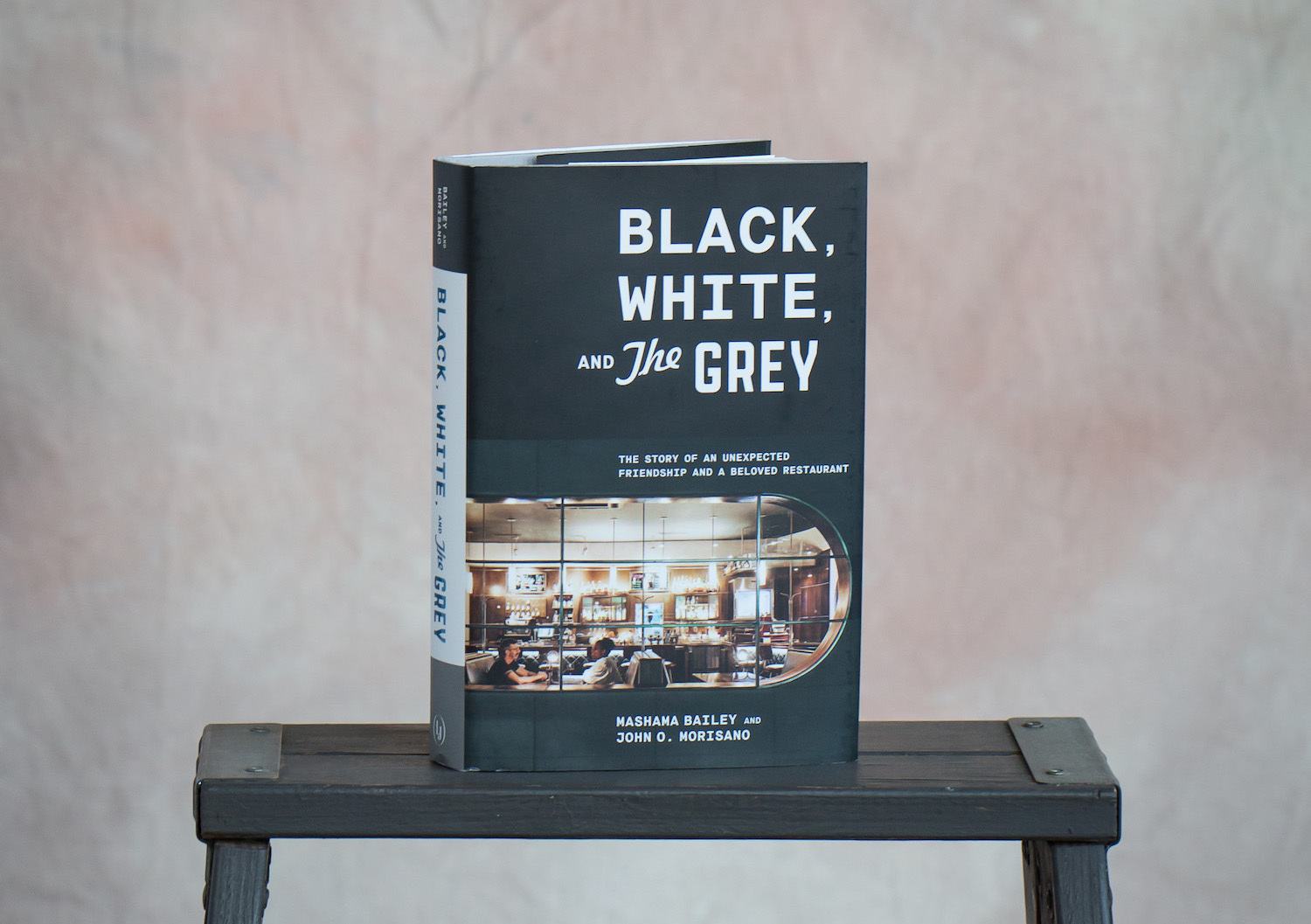 Book cover for Black, White, and The Grey: The Story of an Unexpected Friendship and a Beloved Restaurant by Ten Speed Press. March 2021