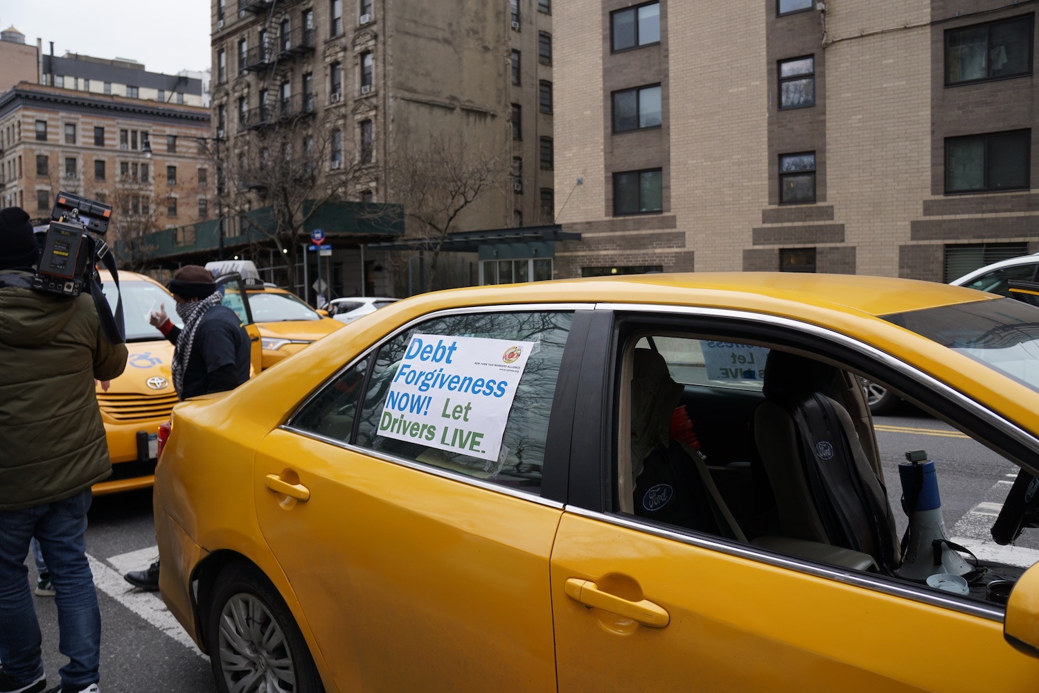 A line of taxi cabs parked down Amsterdam Avenue in Manhattan in support of strikers on March 16, 2021.