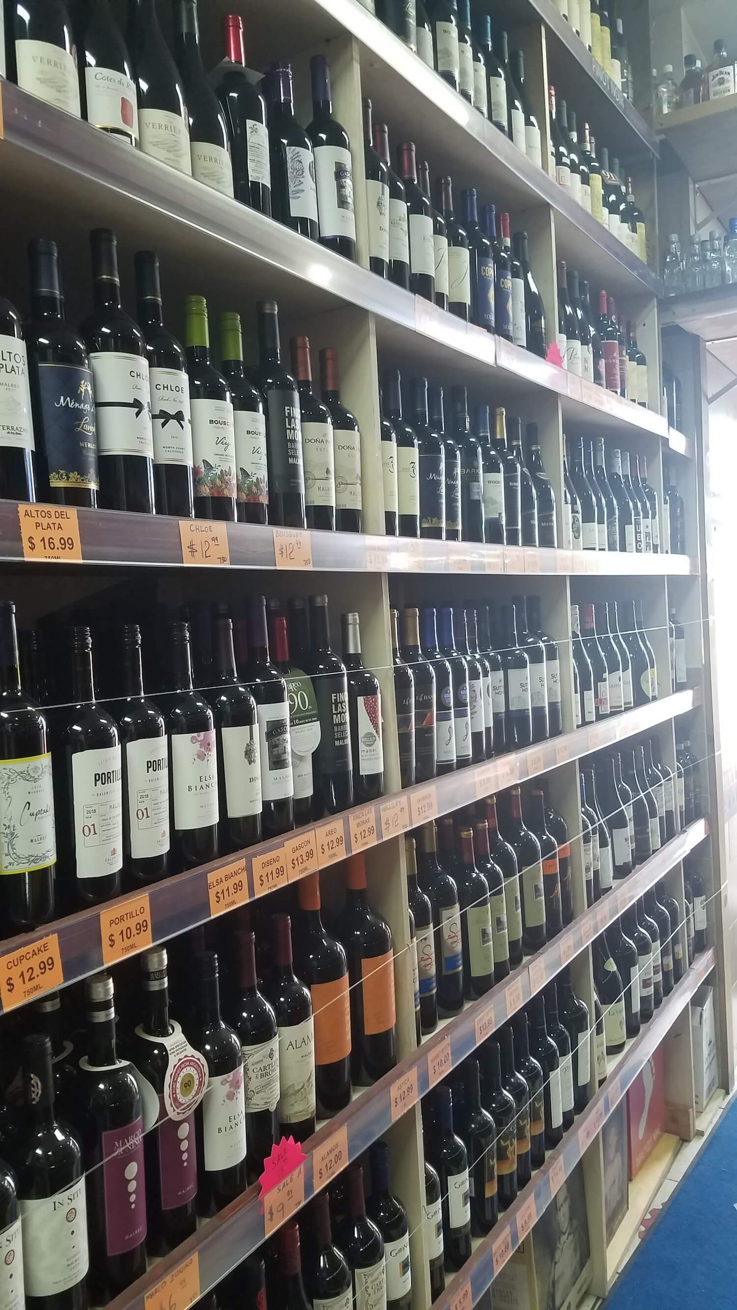 Rows of wine on the shelf in the wine store Melover Wine & Spirit in East Harlem. March 2021