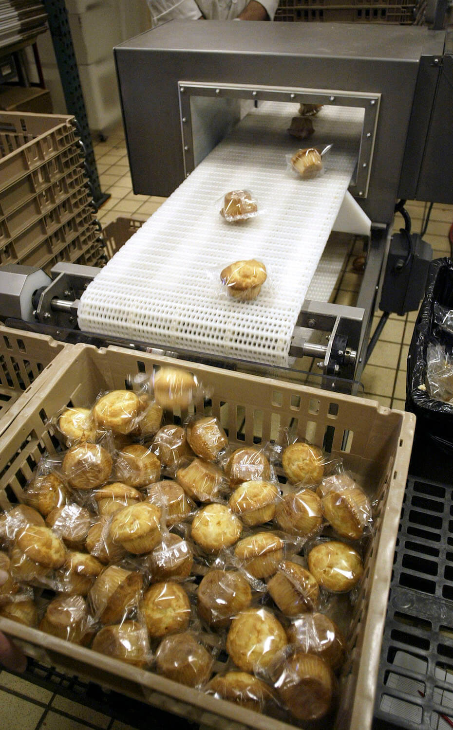 Freshly baked muffins are run through a metal detector, before they leave the Airway Heights Corrections Center Food Factory November 10, 2005 in Airway Heights, Washington.