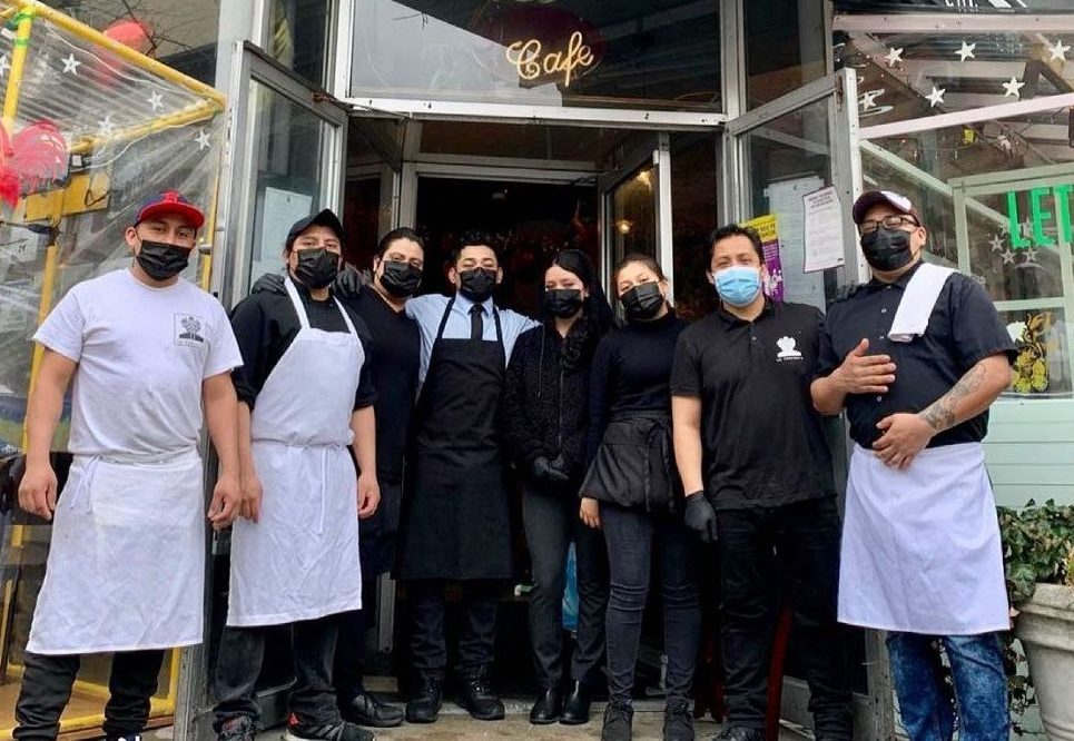The restaurant workers of La Contenta in NYC pose in their masks in front of the restaurant. May 2021