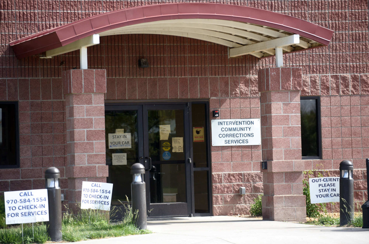 Signage surrounds the entrance to the Weld County Intervention Community Correction Services, 1101 H St.