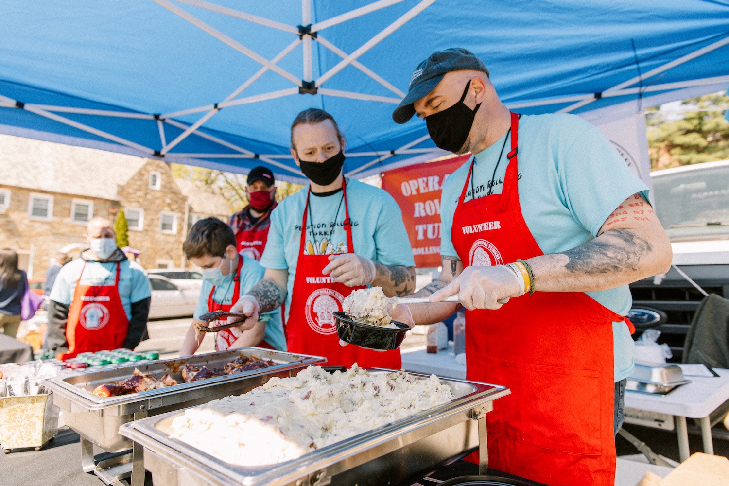 Berman serving food during an Operation Rolling Turkey initiative. June 2021
