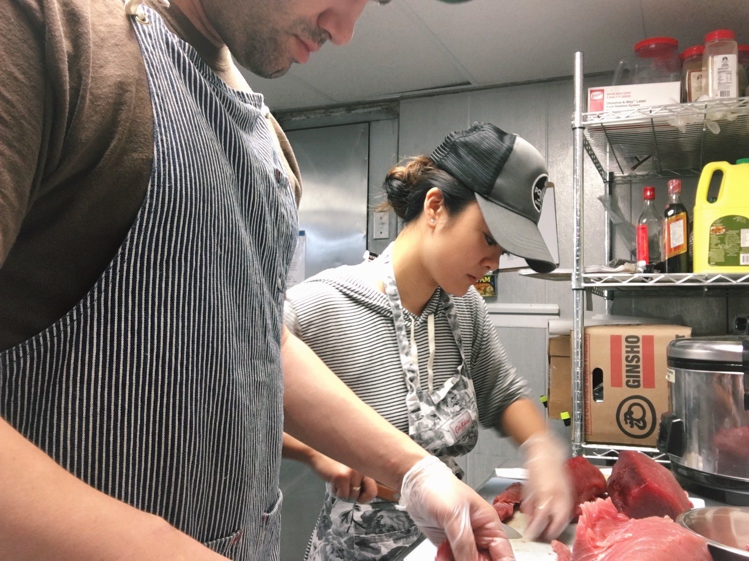 Kiki Aranita cutting tuna in her restaurant which closed during Covid. July 2021