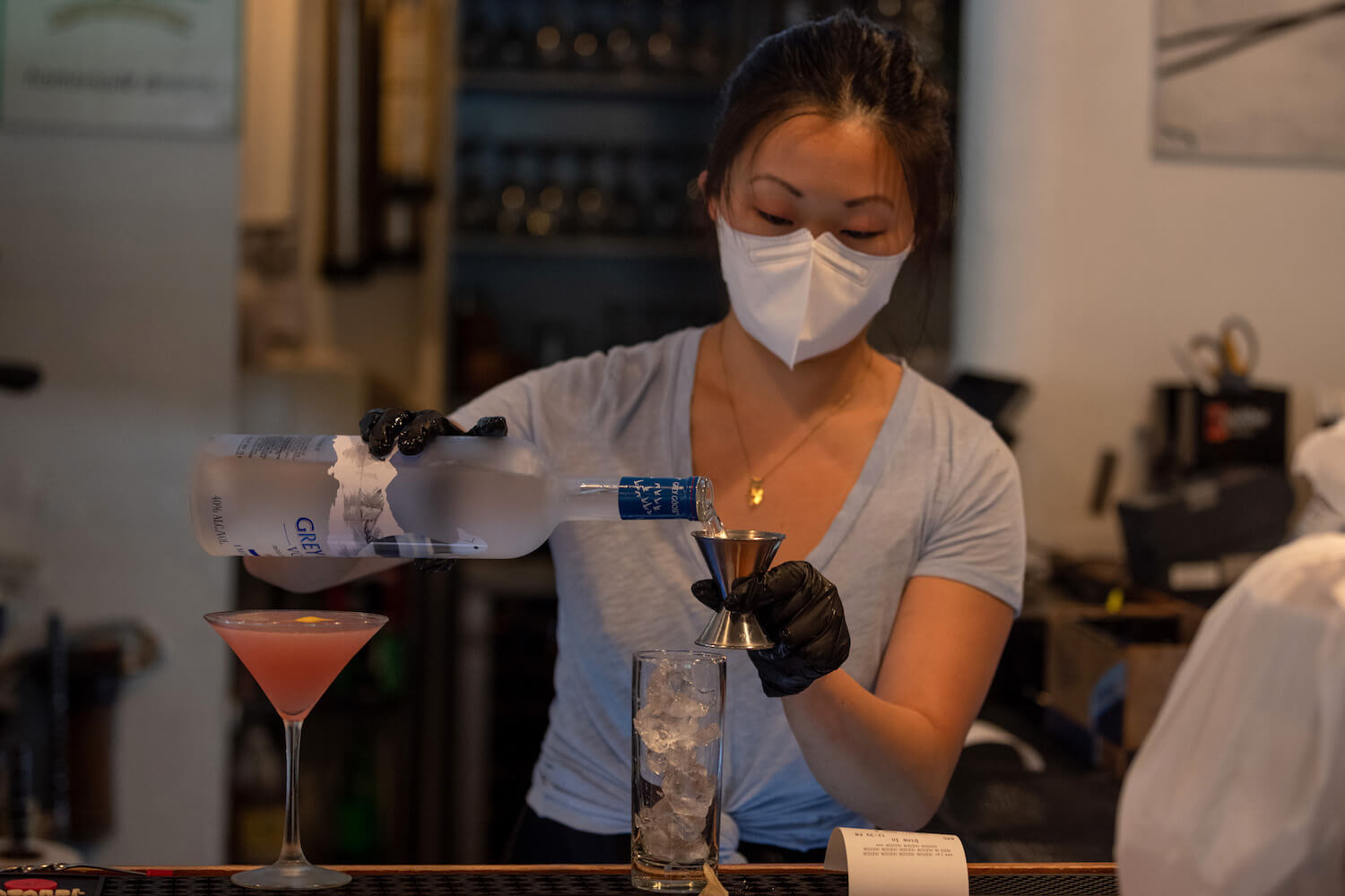 The manager wearing a mask prepares a cocktail at Westville Hudson as the city continues Phase 4 of re-opening following restrictions imposed to slow the spread of coronavirus on September 30, 2020 in New York City. July 2021