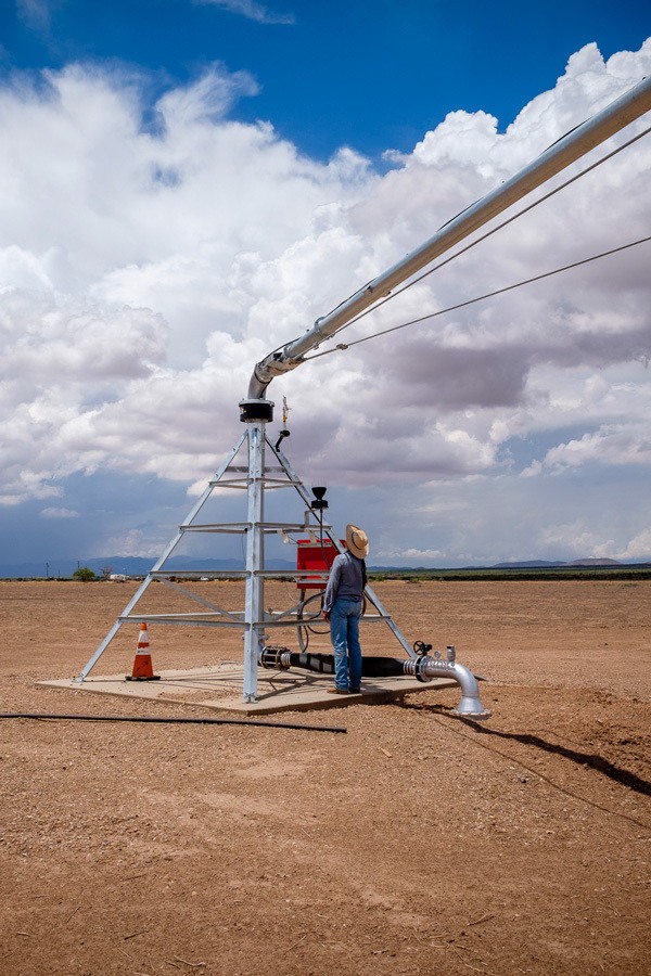 Anastasia Rabin looks at a new quarter-mile center pivot on land that Riverview recently purchased in Elfrida, Arizona. July 2021