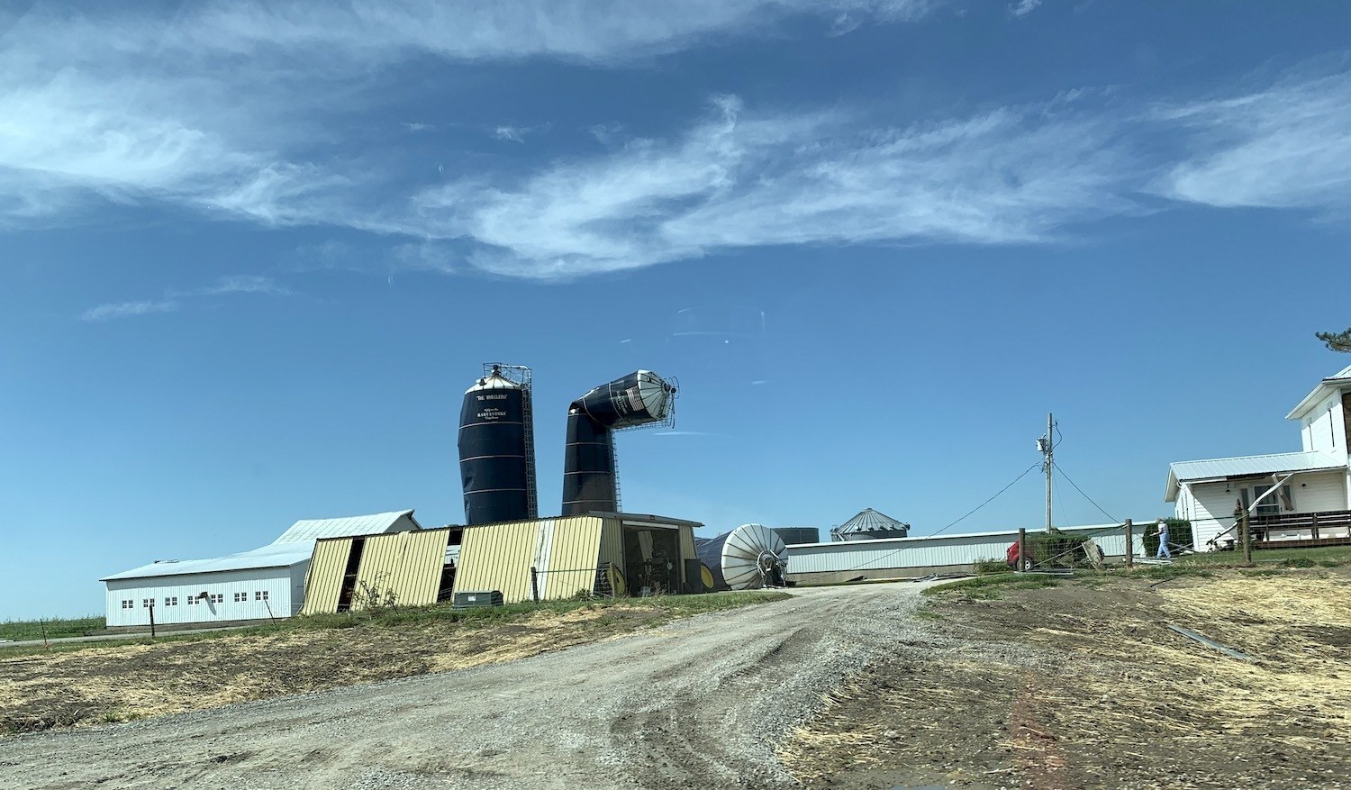 Grain bins seen in the distance damaged by the derecho in Benton County. August 2020