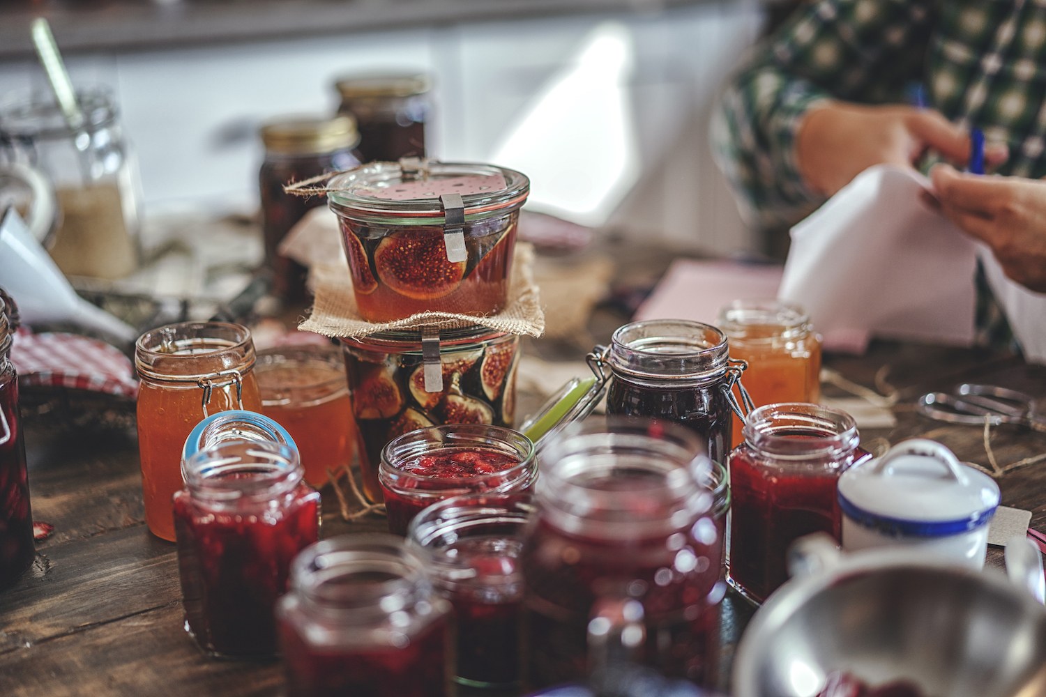 Preparing Homemade Strawberry, Blueberry and Raspberry Jam and Canning in Jars